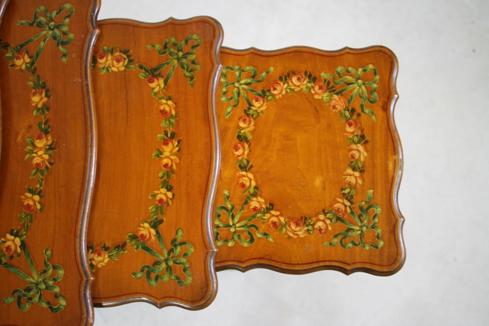 AN EDWARDIAN SATINWOOD AND POLYCHROME PAINTED QUARTETTO NEST OF TABLES of serpentine oblong form Image
