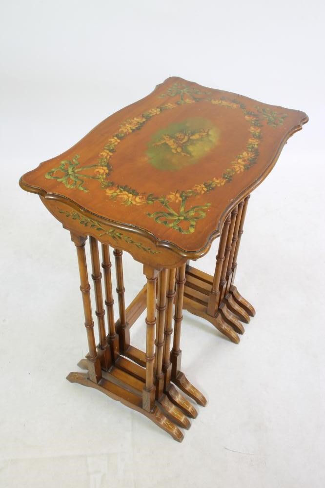 AN EDWARDIAN SATINWOOD AND POLYCHROME PAINTED QUARTETTO NEST OF TABLES of serpentine oblong form Image
