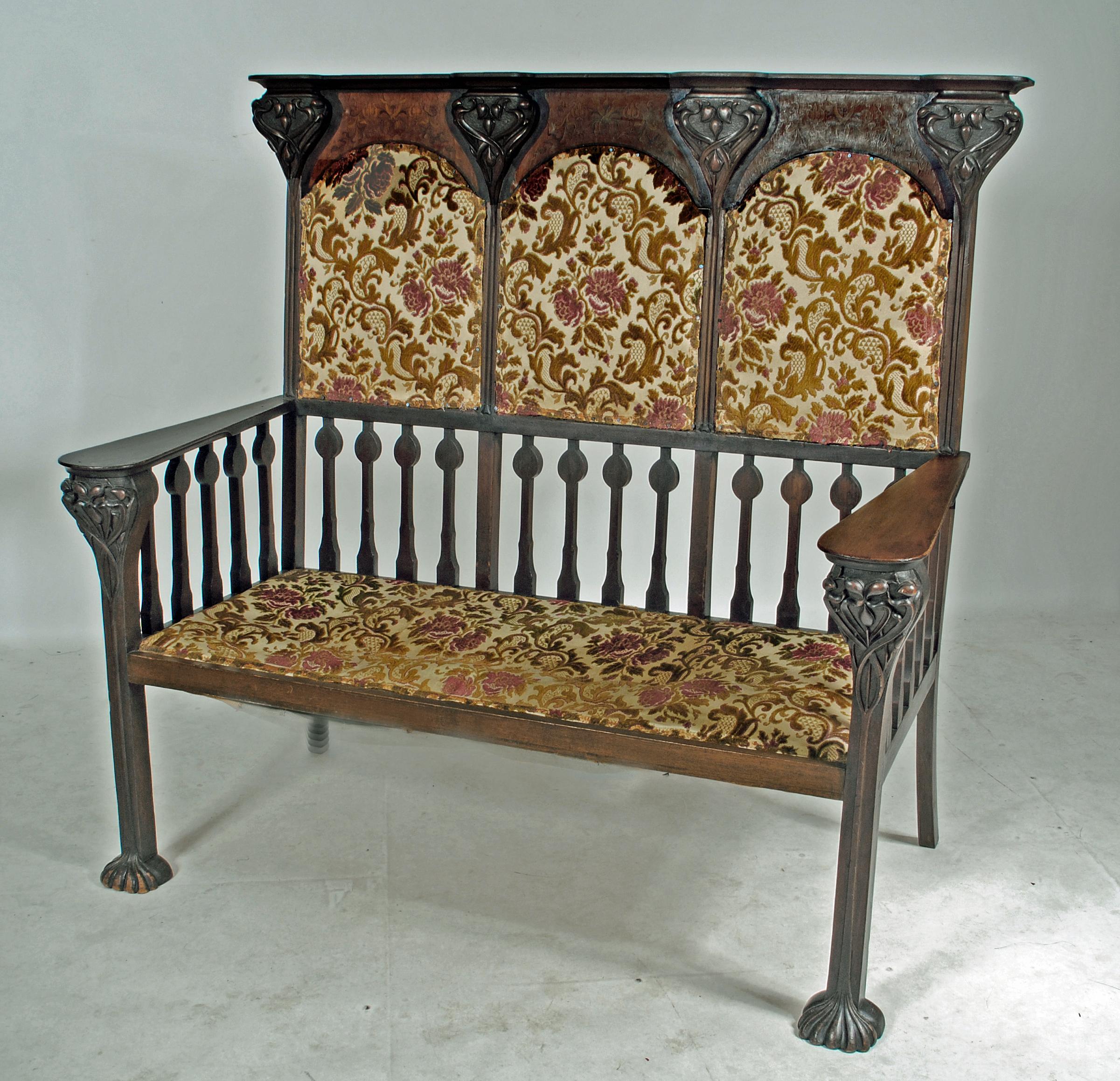 AN ART NOUVEAU MAHOGANY THREE SEATER HIGH BACK SETTLE in the manner of Shapland & Petter Image