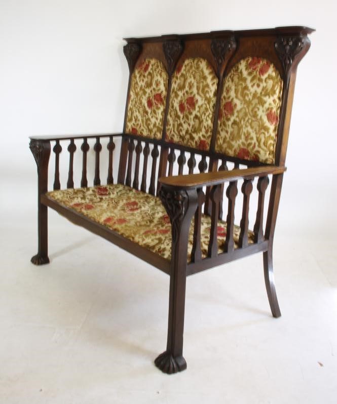 AN ART NOUVEAU MAHOGANY THREE SEATER HIGH BACK SETTLE in the manner of Shapland & Petter Image