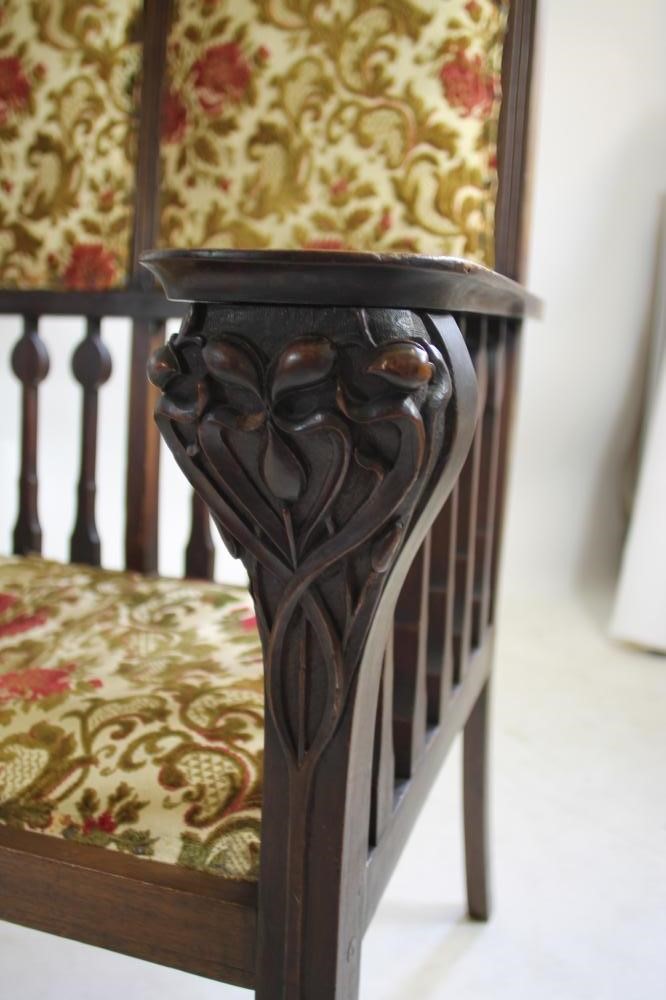 AN ART NOUVEAU MAHOGANY THREE SEATER HIGH BACK SETTLE in the manner of Shapland & Petter Image