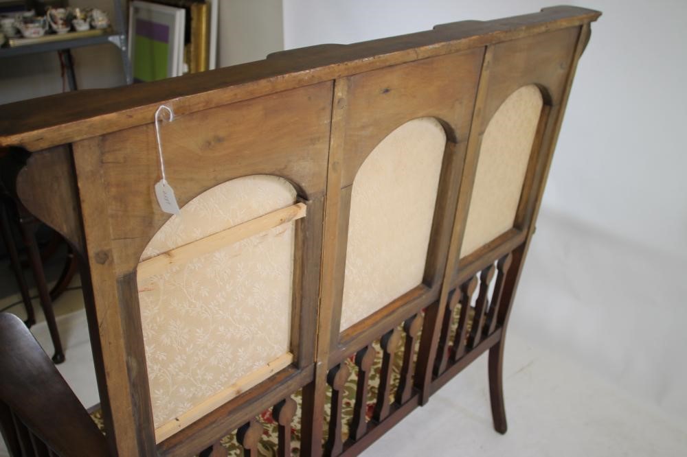 AN ART NOUVEAU MAHOGANY THREE SEATER HIGH BACK SETTLE in the manner of Shapland & Petter Image
