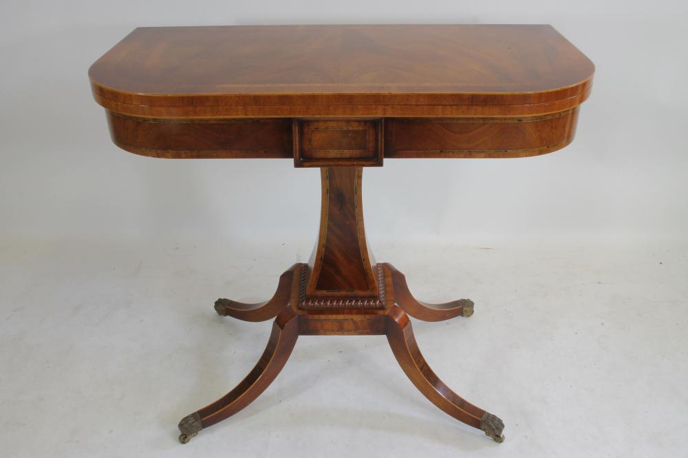 A REGENCY STYLE MAHOGANY FOLDING CARD TABLE Image