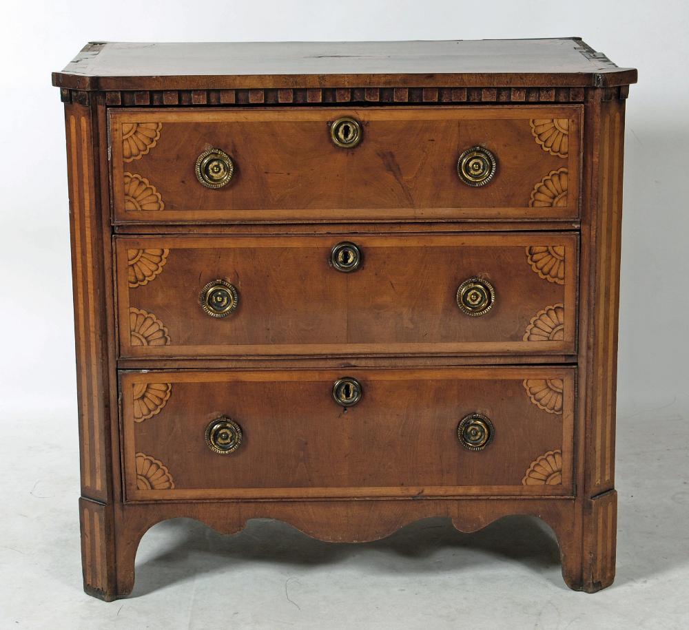 A NORTHERN EUROPEAN MAHOGANY AND MARQUETRY INLAID COMMODE Image