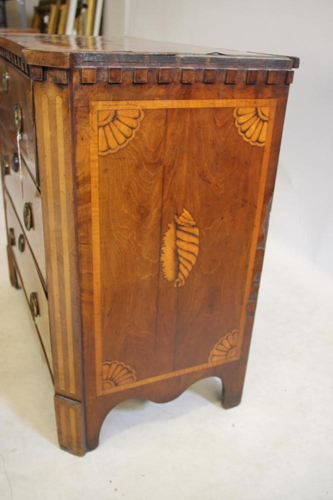 A NORTHERN EUROPEAN MAHOGANY AND MARQUETRY INLAID COMMODE Image