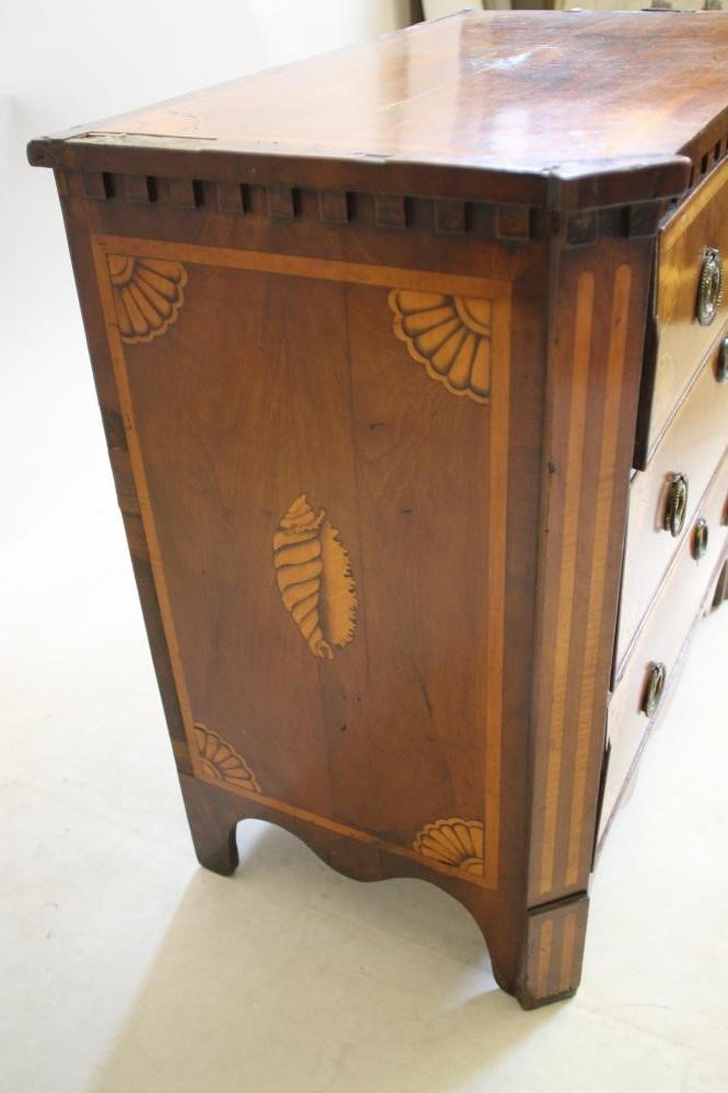 A NORTHERN EUROPEAN MAHOGANY AND MARQUETRY INLAID COMMODE Image