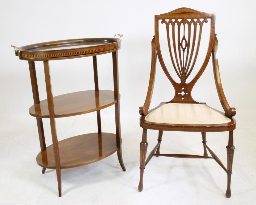 AN EDWARDIAN MAHOGANY ETAGERE of three tier oval form with stringing Image