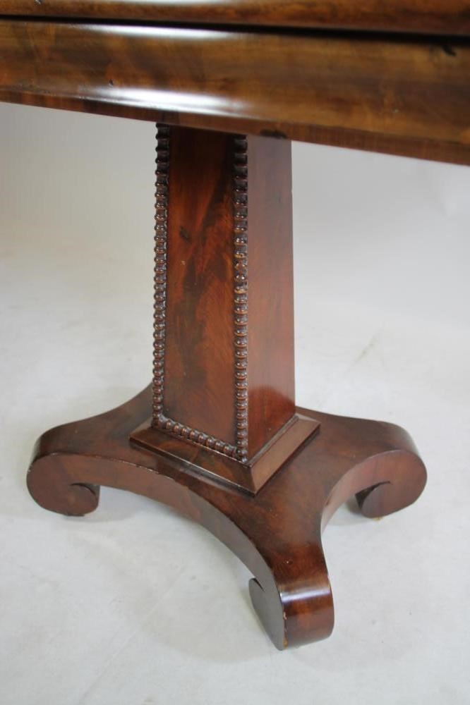 AN EARLY VICTORIAN FOLDING TEA TABLE of rounded oblong form Image