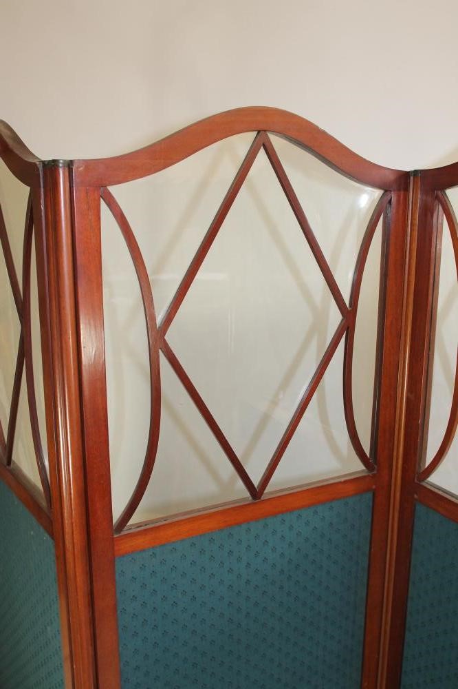 AN EDWARDIAN MAHOGANY AND PART GLAZED FOLDING ROOM SCREEN of four fold oblong form Image