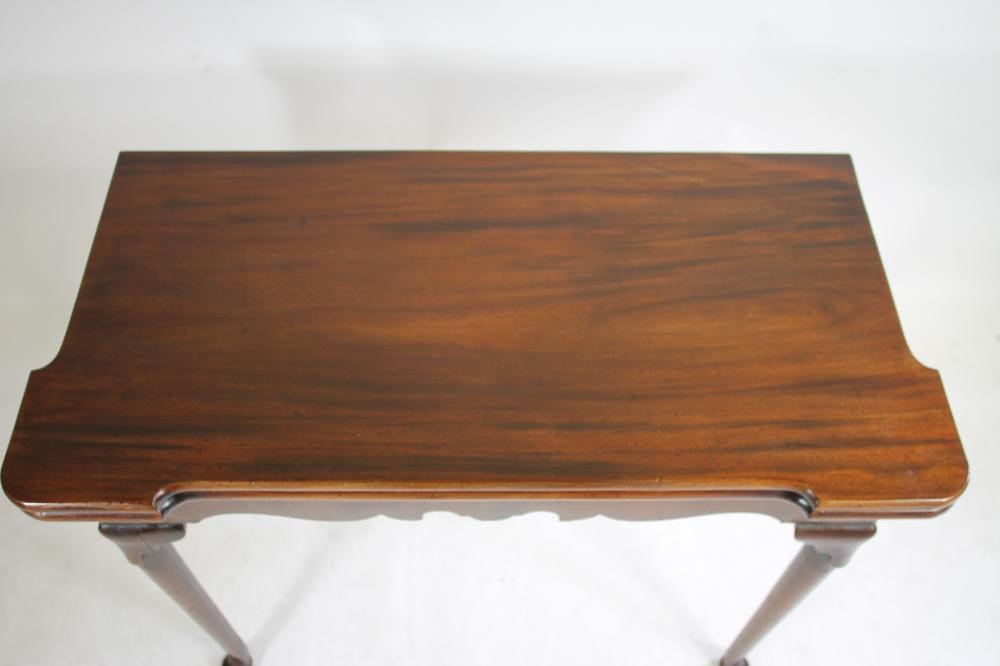 A GEORGIAN MAHOGANY FOLDING TEA TABLE Image