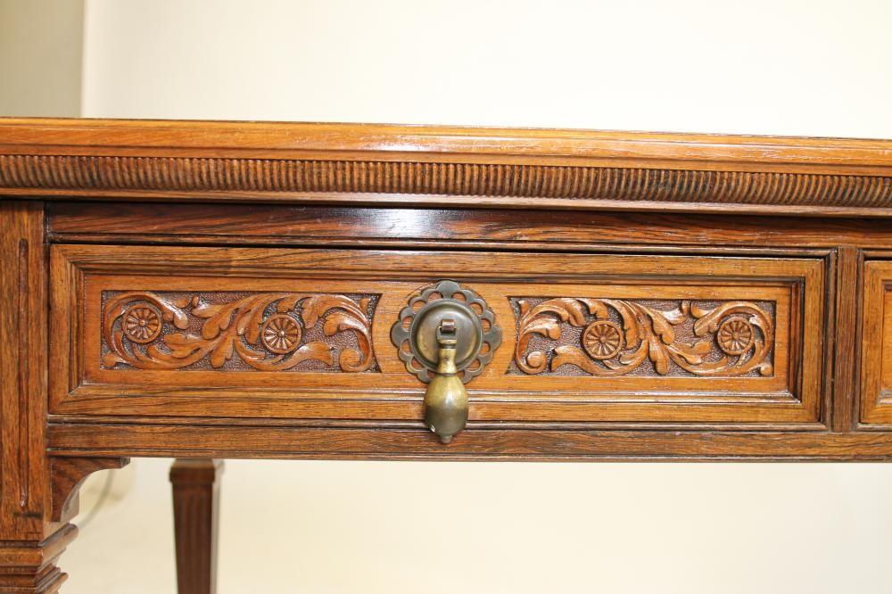 A VICTORIAN ROSEWOOD WRITING TABLE Image