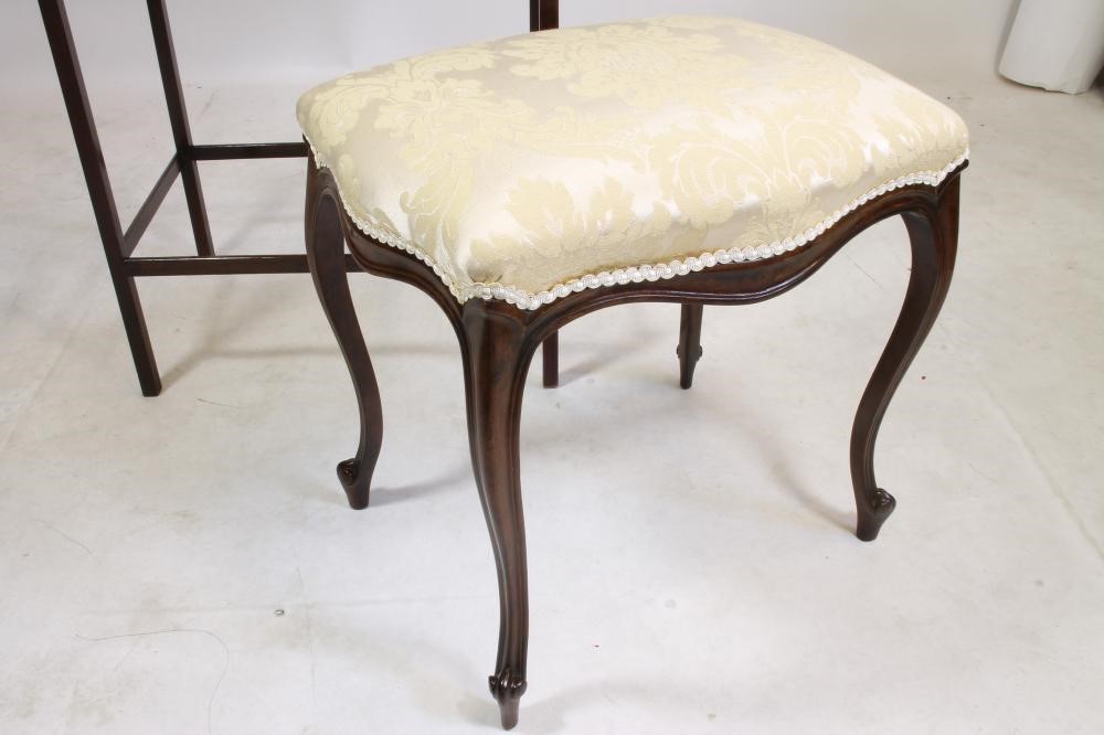 AN EARLY VICTORIAN MAHOGANY STOOL of oblong serpentine form upholstered in ivory damask Image