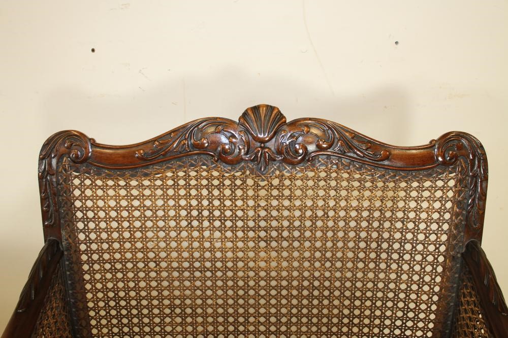 A CARVED WALNUT FRAMED BERGERE SUITE Image