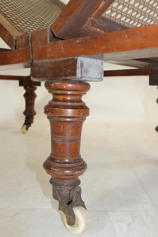 A VICTORIAN CARVED MAHOGANY ADJUSTABLE CAMPAIGN BED by Leveson (Manchester) Image