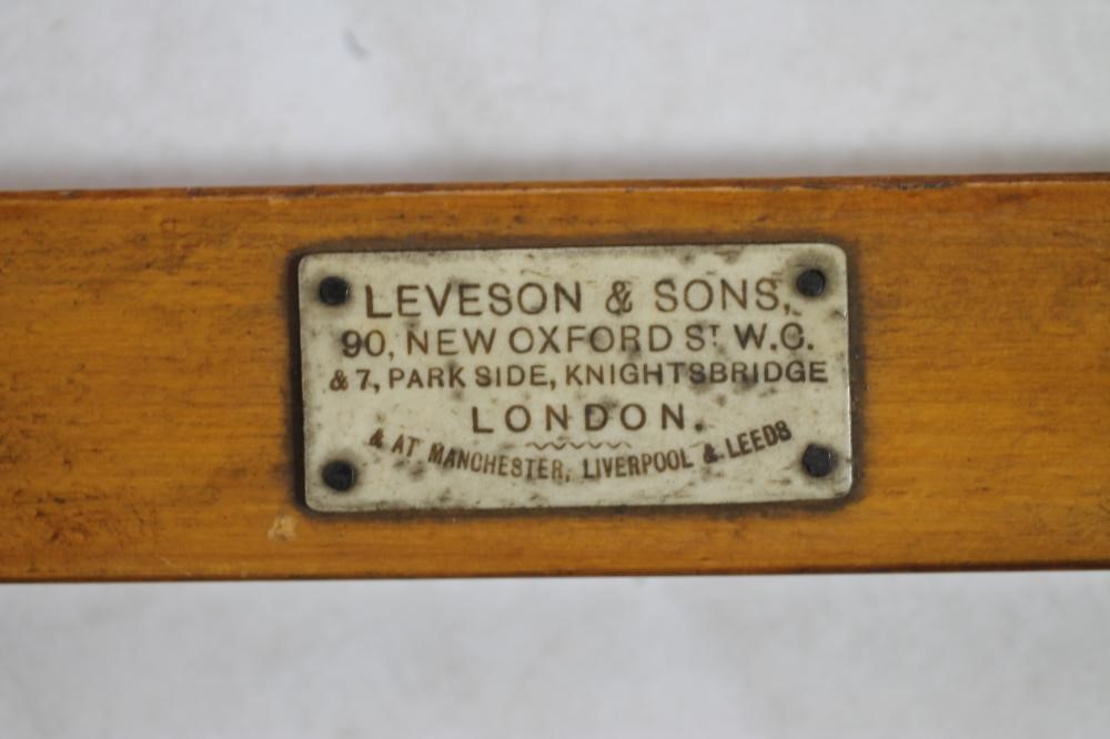 A CANED SATINWOOD CAMPAIGN FOLDING BACKREST by Leveson & Sons Image