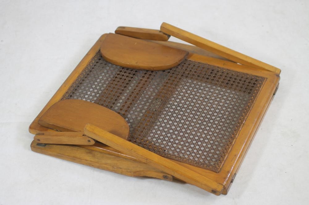 A CANED SATINWOOD CAMPAIGN FOLDING BACKREST by Leveson & Sons Image