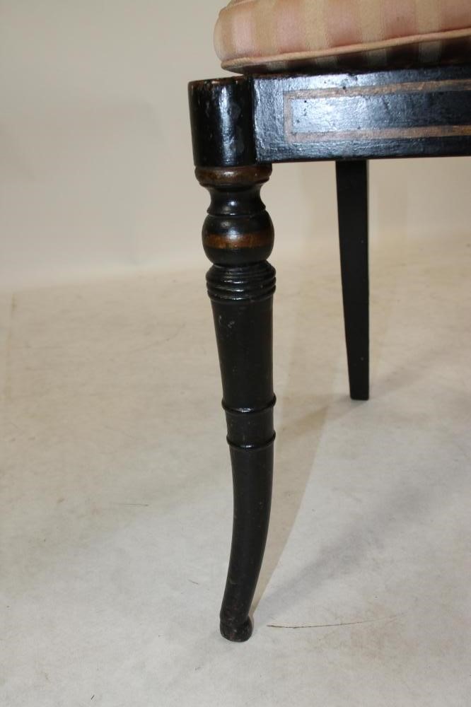 A REGENCY EBONISED AND PARCEL GILT SIDE CHAIR Image