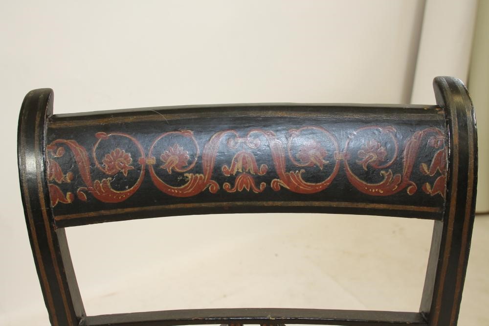 A REGENCY EBONISED AND PARCEL GILT SIDE CHAIR Image