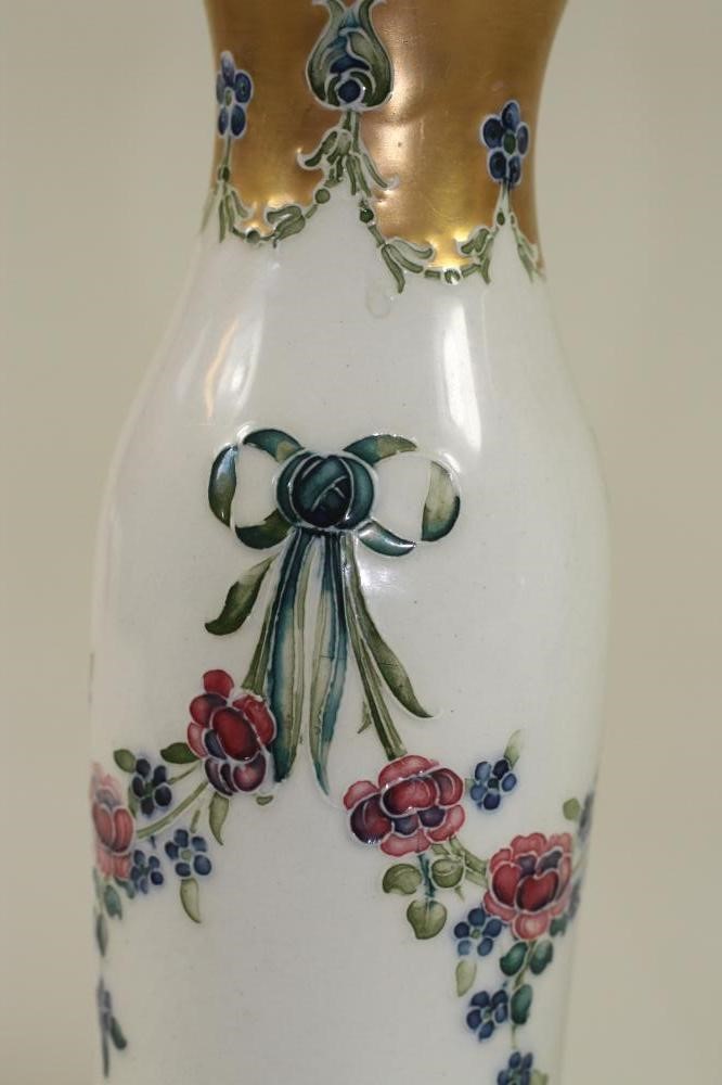 A PAIR OF MACINTYRE MOORCROFT POTTERY "EIGHTEENTH CENTURY" PATTERN VASES Image