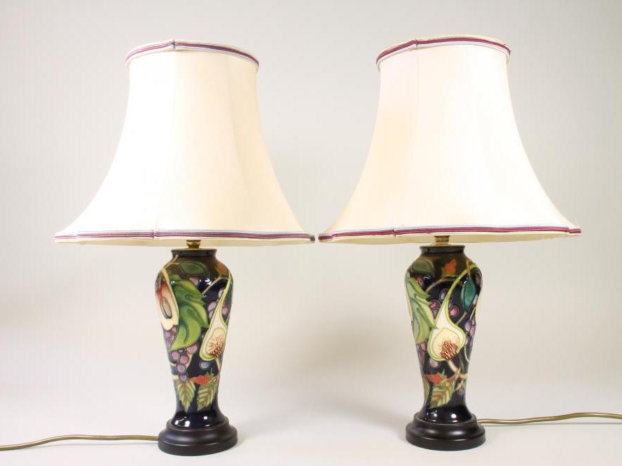 A PAIR OF MOORCROFT POTTERY "QUEENS CHOICE" PATTERN LAMPS Image