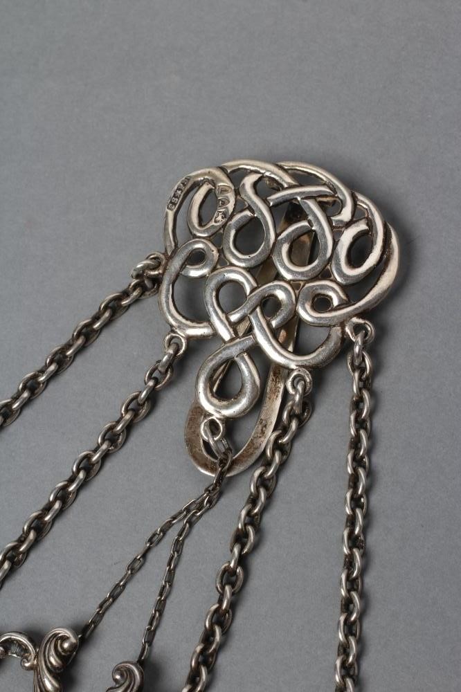 A LATE VICTORIAN SILVER CHATELAINE Image
