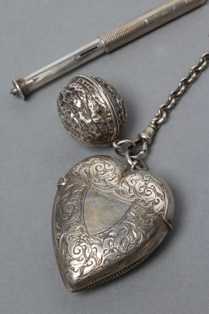 A LATE VICTORIAN SILVER CHATELAINE Image