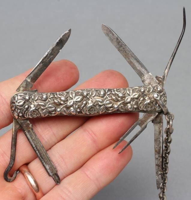 A LATE VICTORIAN SILVER CHATELAINE Image