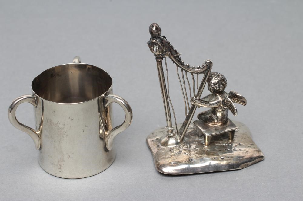 A SMALL SILVER FIGURE Image