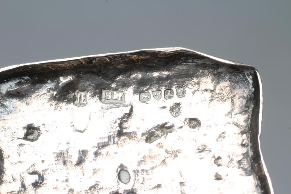 A SMALL SILVER FIGURE Image