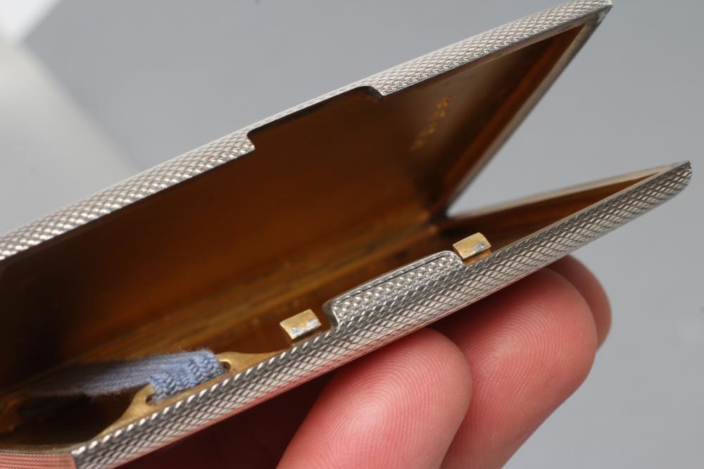 AN ART DECO SILVER CIGARETTE CASE Image