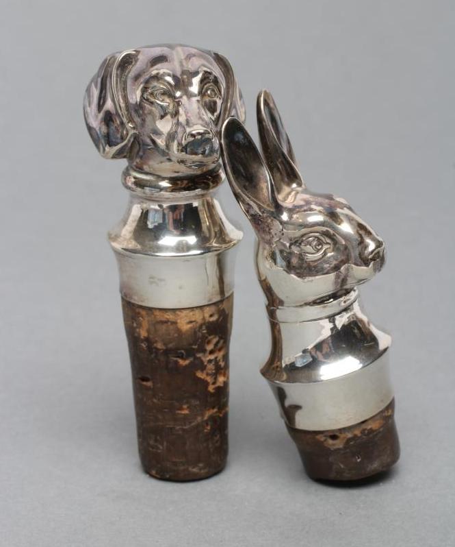 A PAIR OF CONTINENTAL CORK BOTTLE STOPPERS hollow stamped as a hare and beagle head Image
