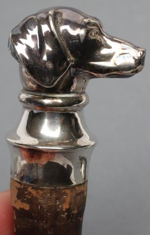 A PAIR OF CONTINENTAL CORK BOTTLE STOPPERS hollow stamped as a hare and beagle head Image