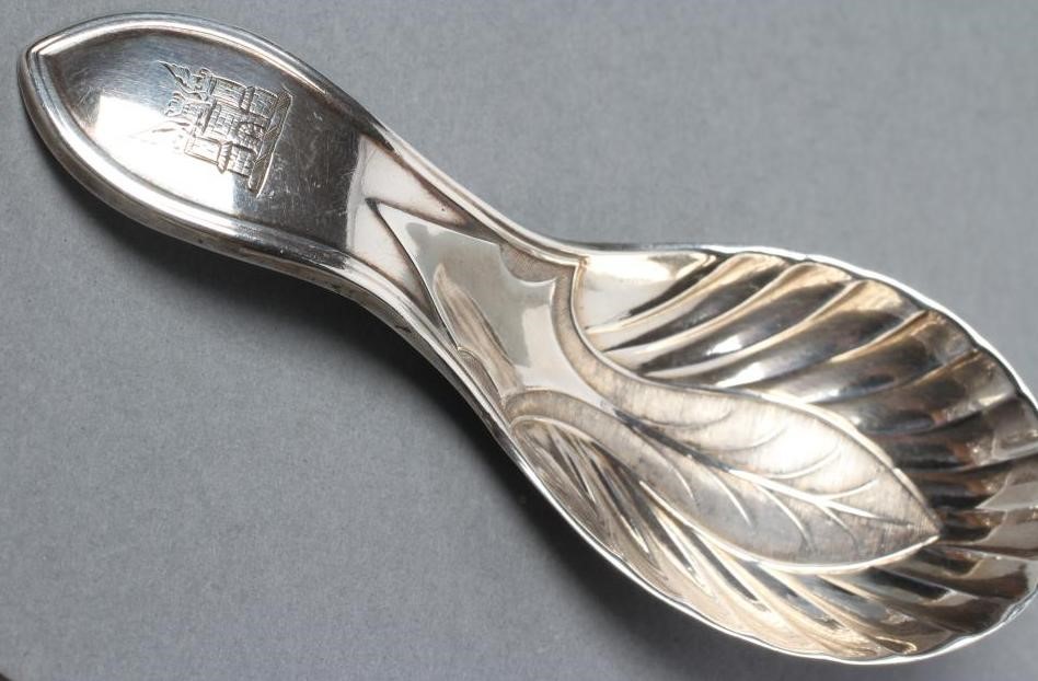 A GEORGE III SILVER CADDY SPOON Image