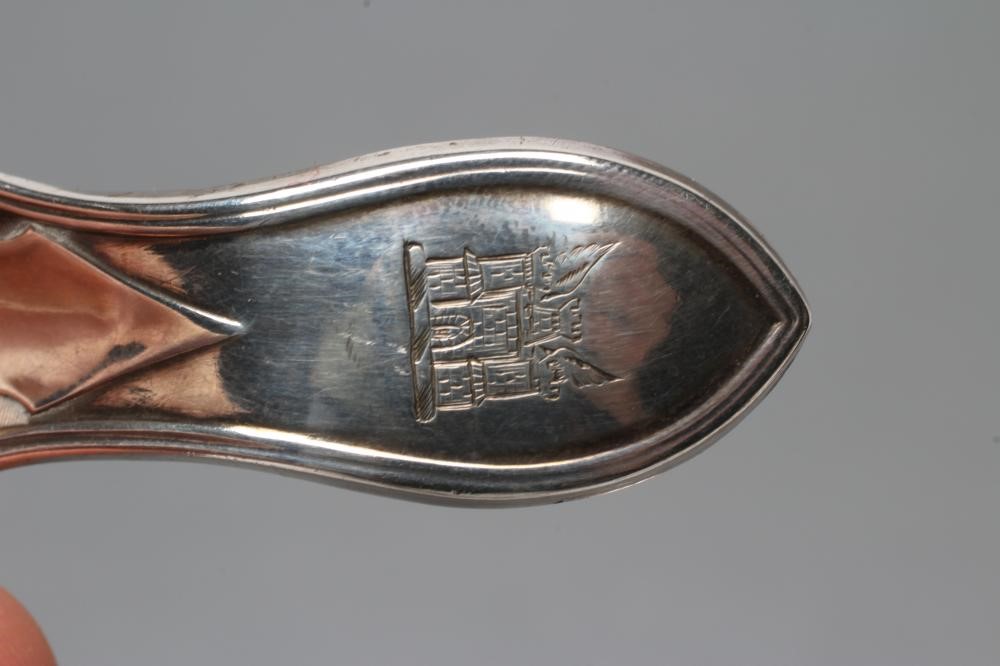 A GEORGE III SILVER CADDY SPOON Image