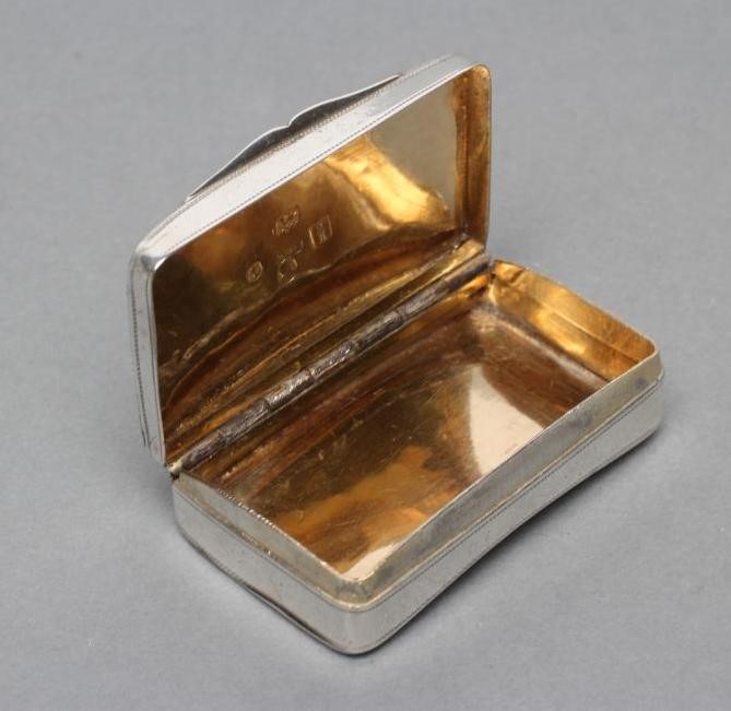 A LATE GEORGE III SILVER SNUFF BOX Image