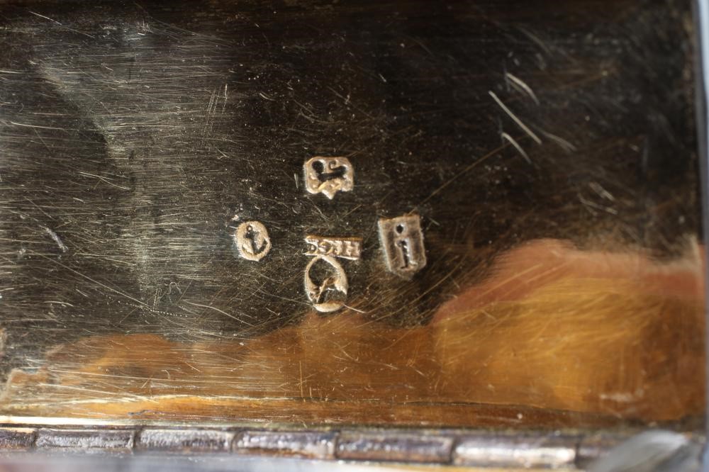 A LATE GEORGE III SILVER SNUFF BOX Image