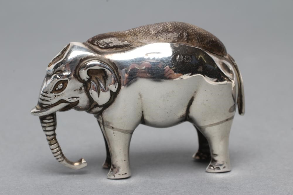 THREE NOVELTY SILVER PIN CUSHIONS comprising a shoe with bow and buckle on a Louis heel Image