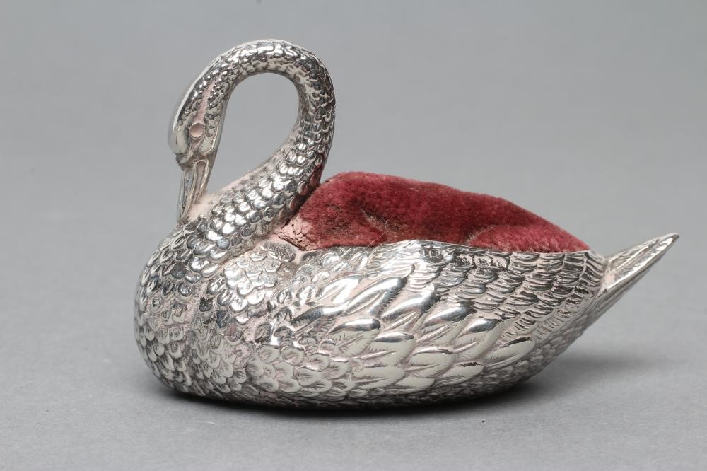 THREE NOVELTY SILVER PIN CUSHIONS comprising a shoe with bow and buckle on a Louis heel Image