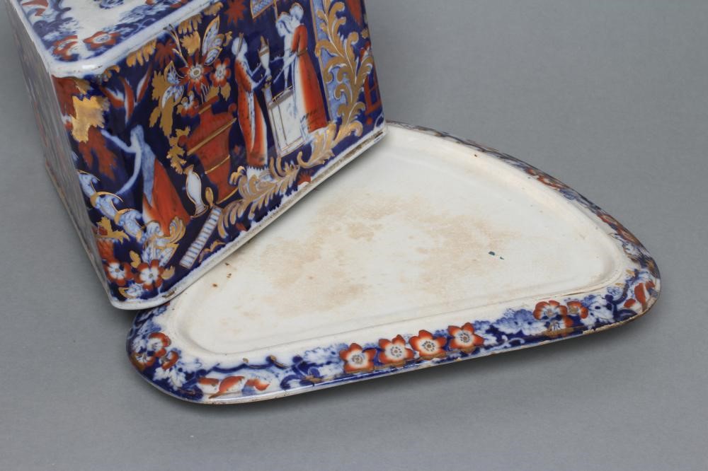 A VICTORIAN STAFFORDSHIRE POTTERY CHEESE WEDGE AND STAND printed in underglaze blue and overpainted Image