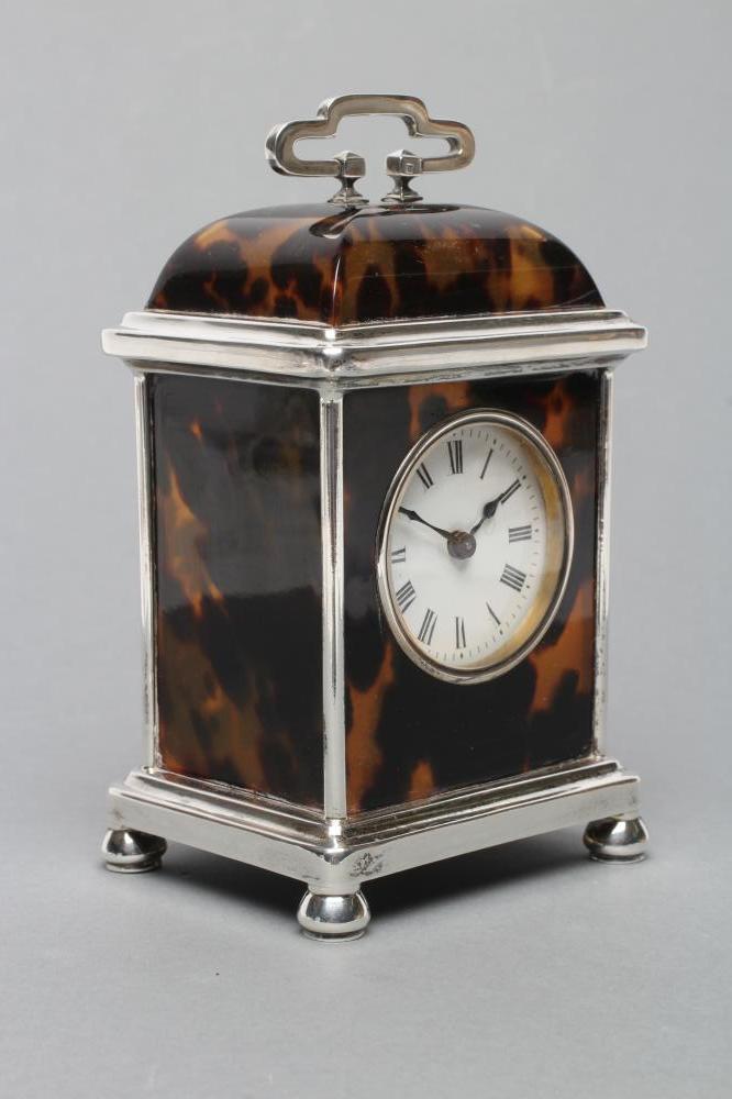 A SILVER MOUNTED TORTOISESHELL CARRIAGE CLOCK Image
