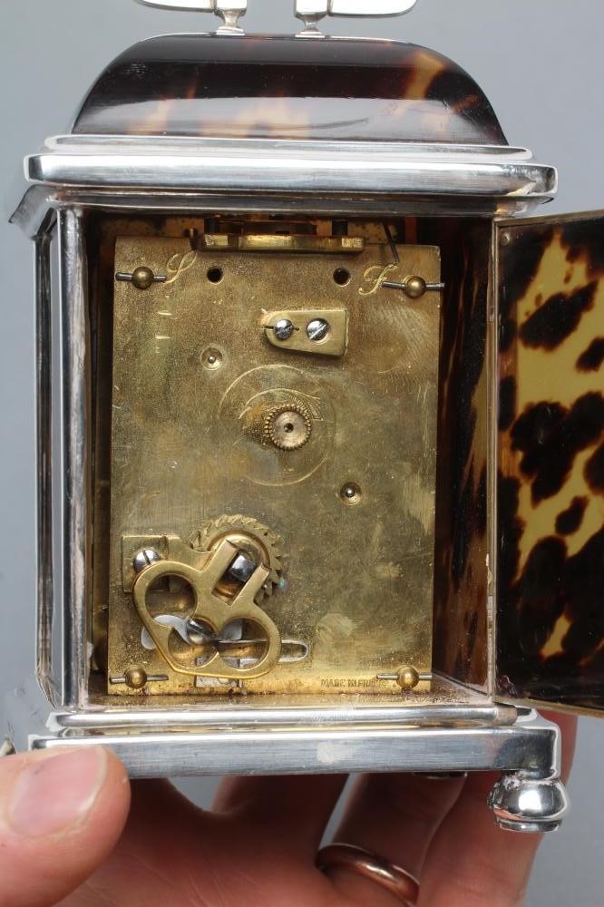 A SILVER MOUNTED TORTOISESHELL CARRIAGE CLOCK Image