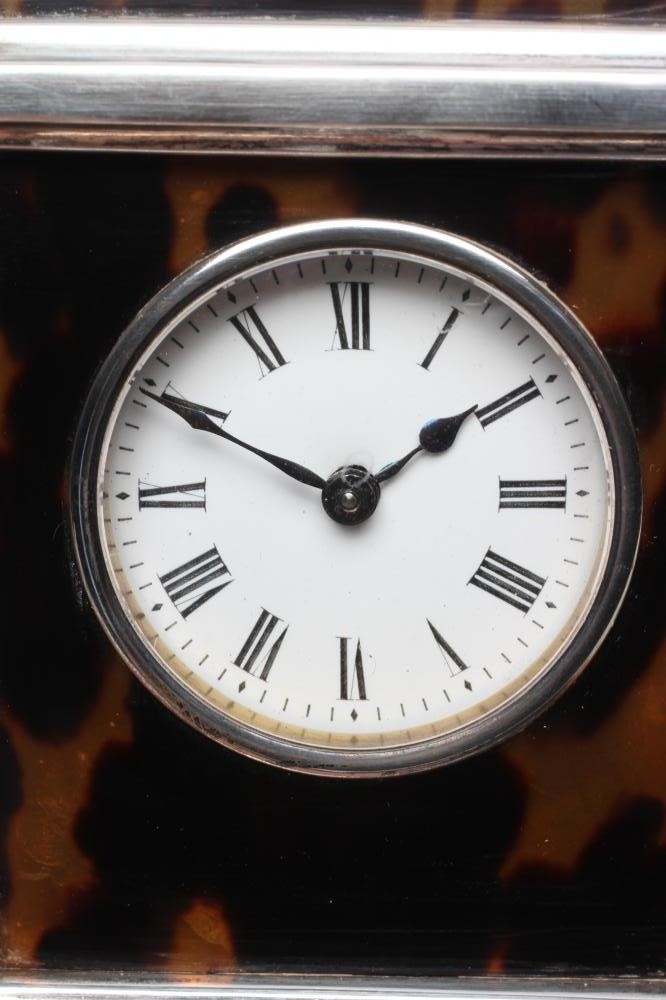 A SILVER MOUNTED TORTOISESHELL CARRIAGE CLOCK Image