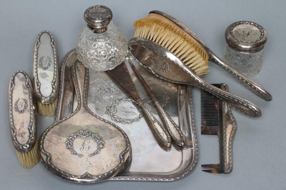 AN EDWARDIAN ELEVEN PIECE DRESSING TABLE SET Image