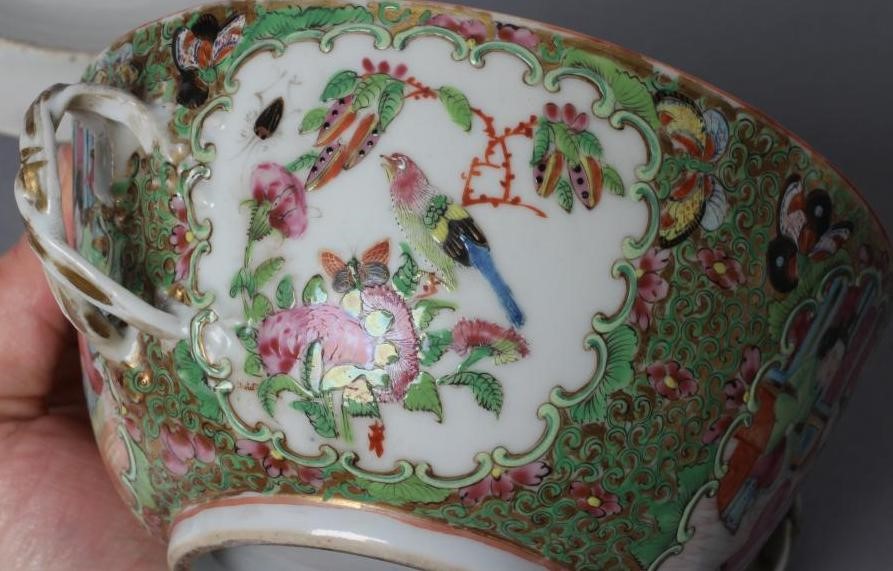 A CANTONESE PORCELAIN ECUELLE AND COVER of circular form with two entwined handles Image