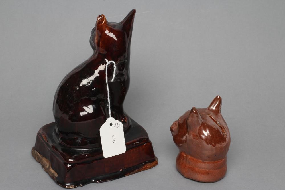 AN ENGLISH TREACLE GLAZED STONEWARE CAT Image