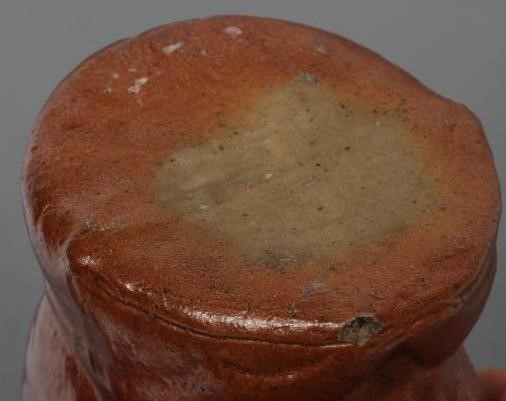 AN ENGLISH TREACLE GLAZED STONEWARE CAT Image