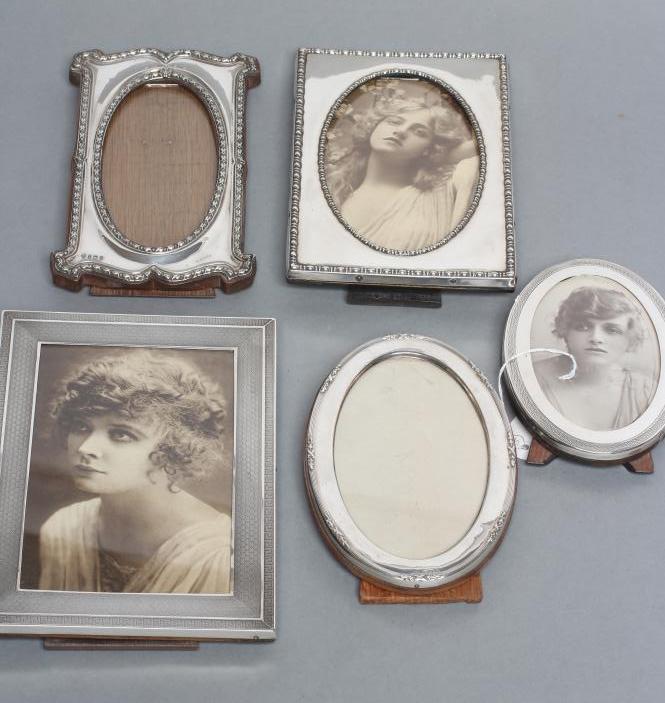 A COLLECTION OF FIVE EASEL BACK PHOTOGRAPH FRAMES Image