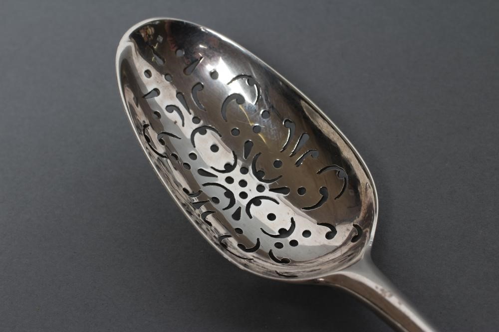 A LARGE PRICKET SPOON Image