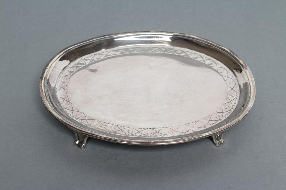 A LATE GEORGE III TEAPOT STAND Image