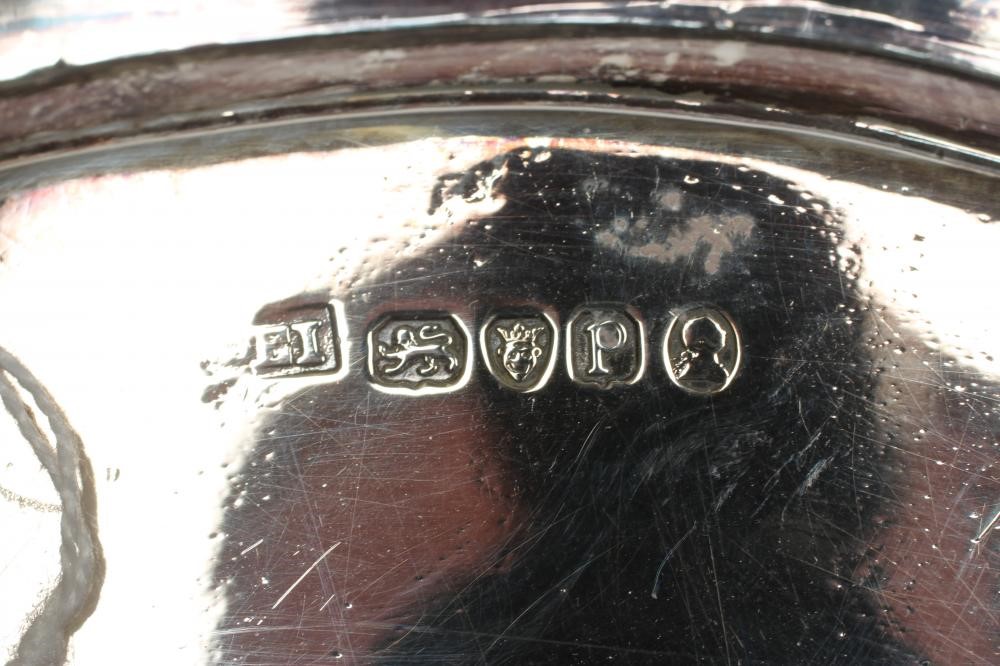 A LATE GEORGE III TEAPOT STAND Image